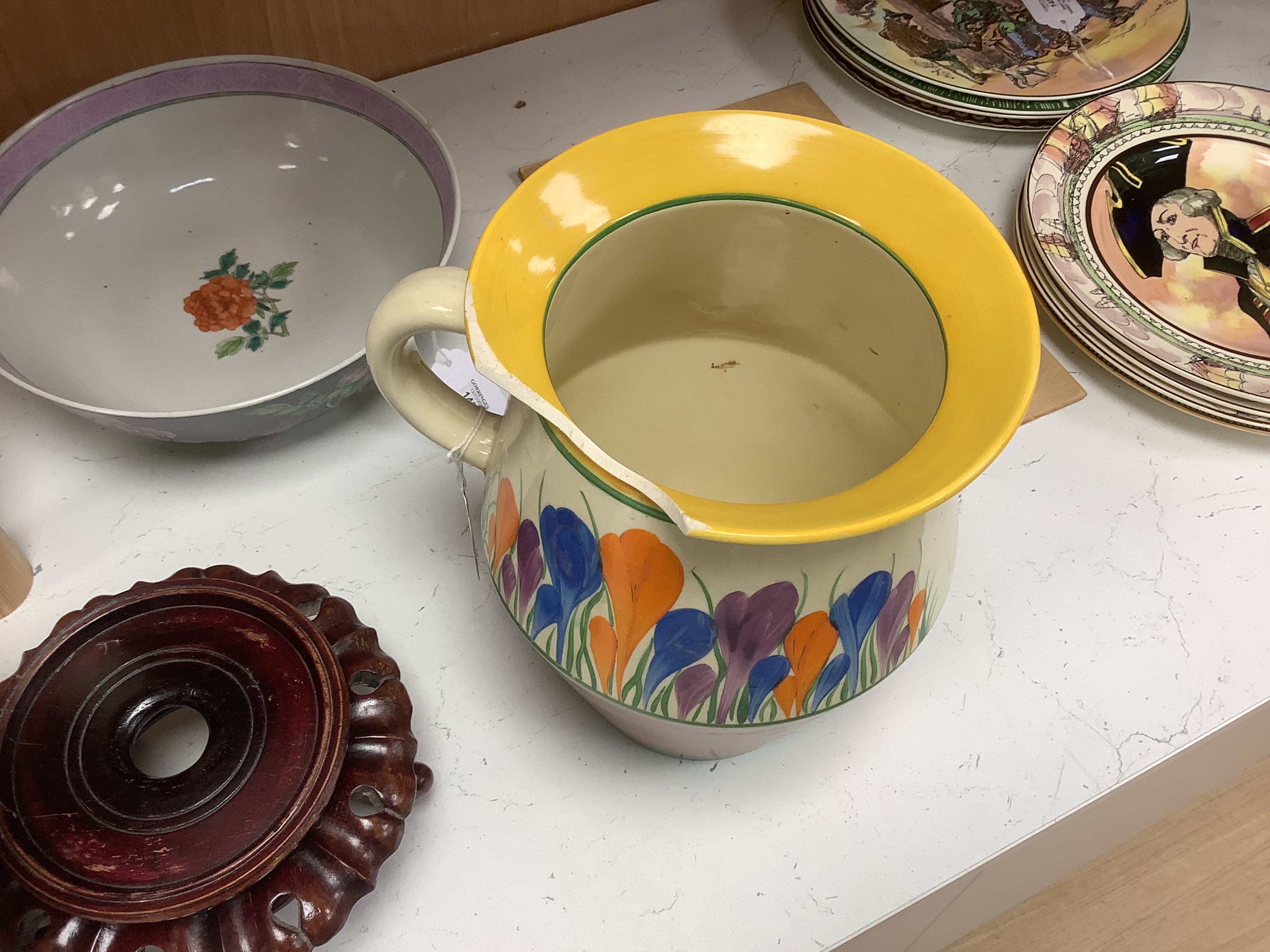 A Clarice Cliff Crocus pattern jug and basin, chamber pot and teapot with cover missing, basin 37cm diameter